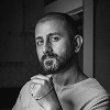 Black and white portrait of a bearded man