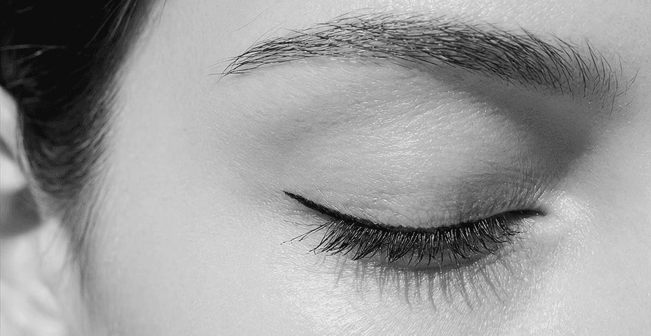 Close-up of a closed eye with eyeliner