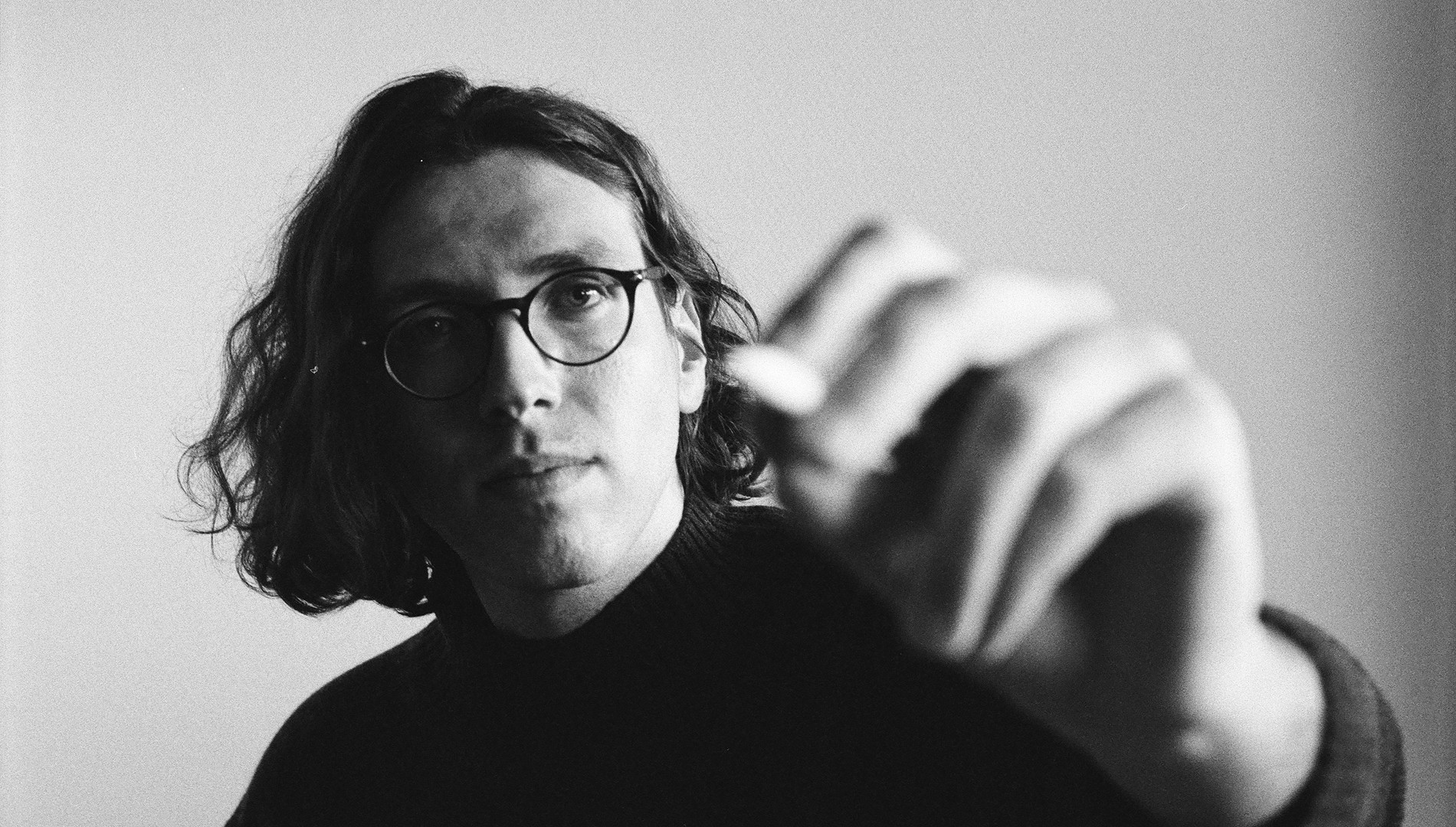 Black and white portrait of a man wearing glasses